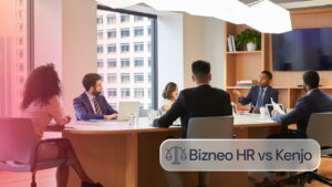 Equipo de profesionales reunido en una sala de juntas y trabajando con herramientas digitales
